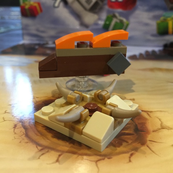 LEGO microscale build of the Sarlaac Pit from Return of the Jedi with Jabba's sail barge floating behind it.