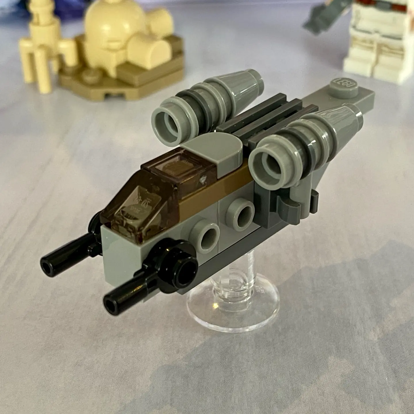 LEGO micro-scale build of the Razor Crest, a light gray spaceship with two engine clusters. This version is 7 studs long, which gives it nice proportions.