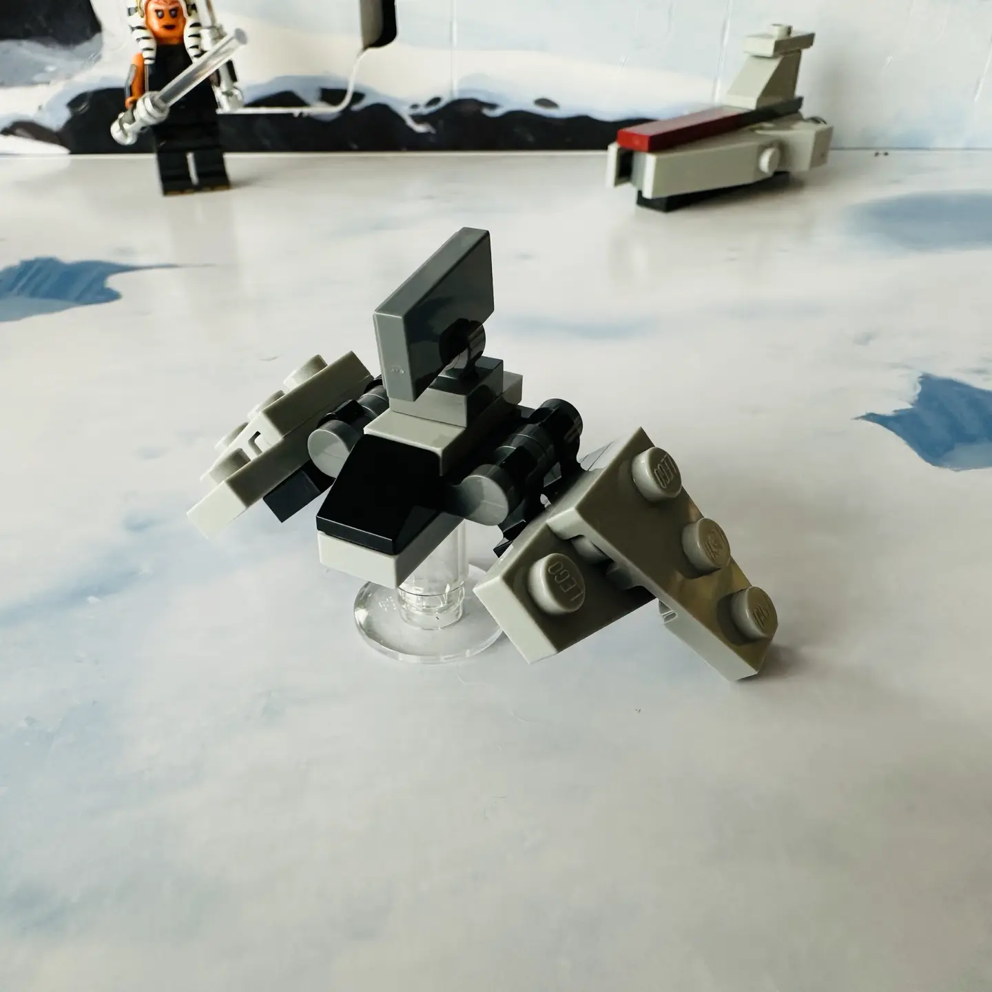 LEGO micro-scale model of a a light gray tri-wing imperial shuttle with a black windscreen with its side wings folded down in flight mode