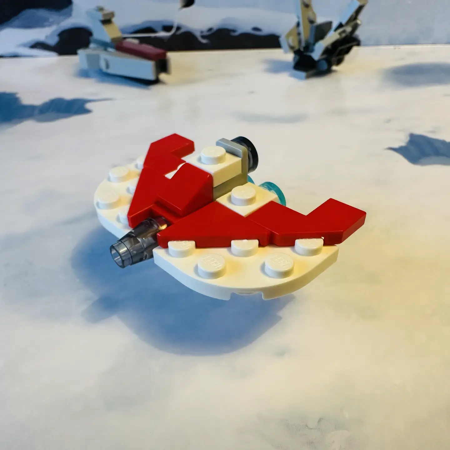 LEGO micro-scale model of a white spaceship with red trim