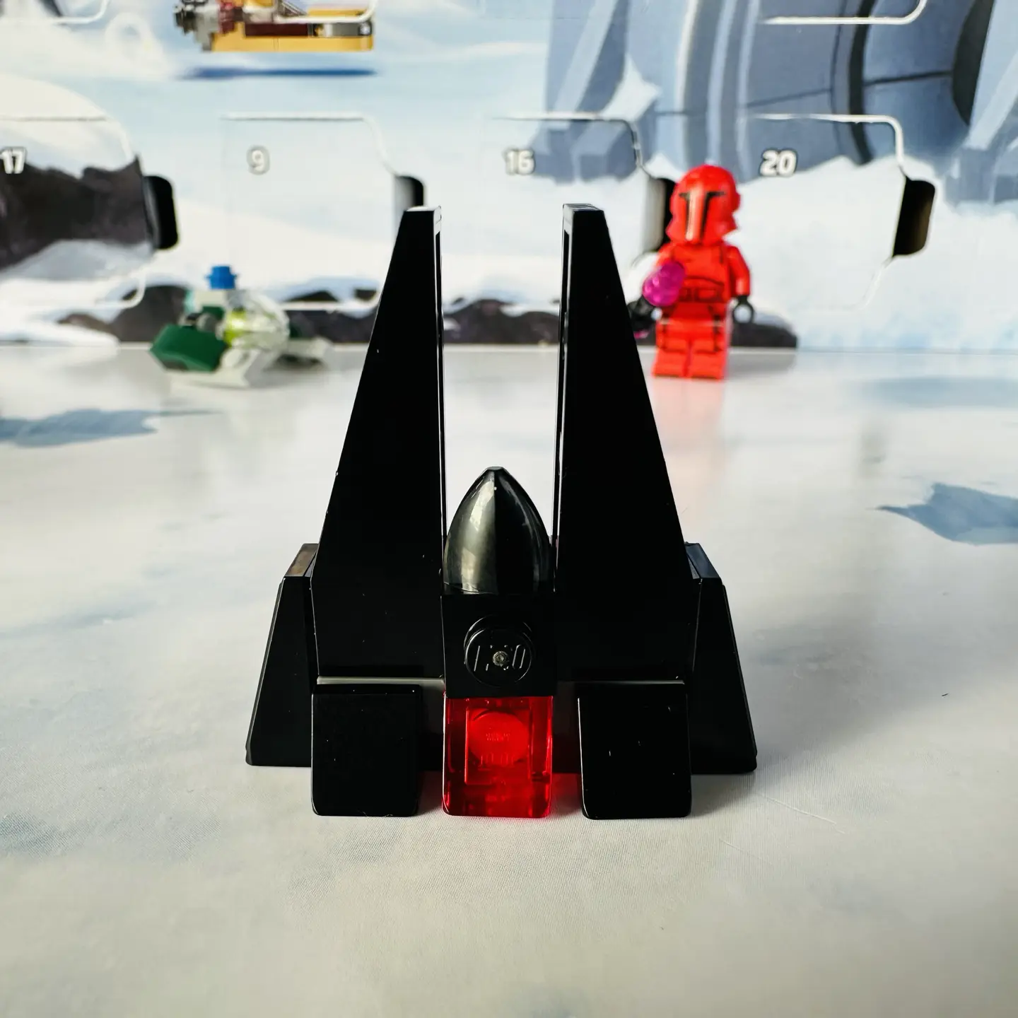 LEGO micro-scale build of Darth Vader's castle on Mustafar. It is pointy and black with a glowing red door.