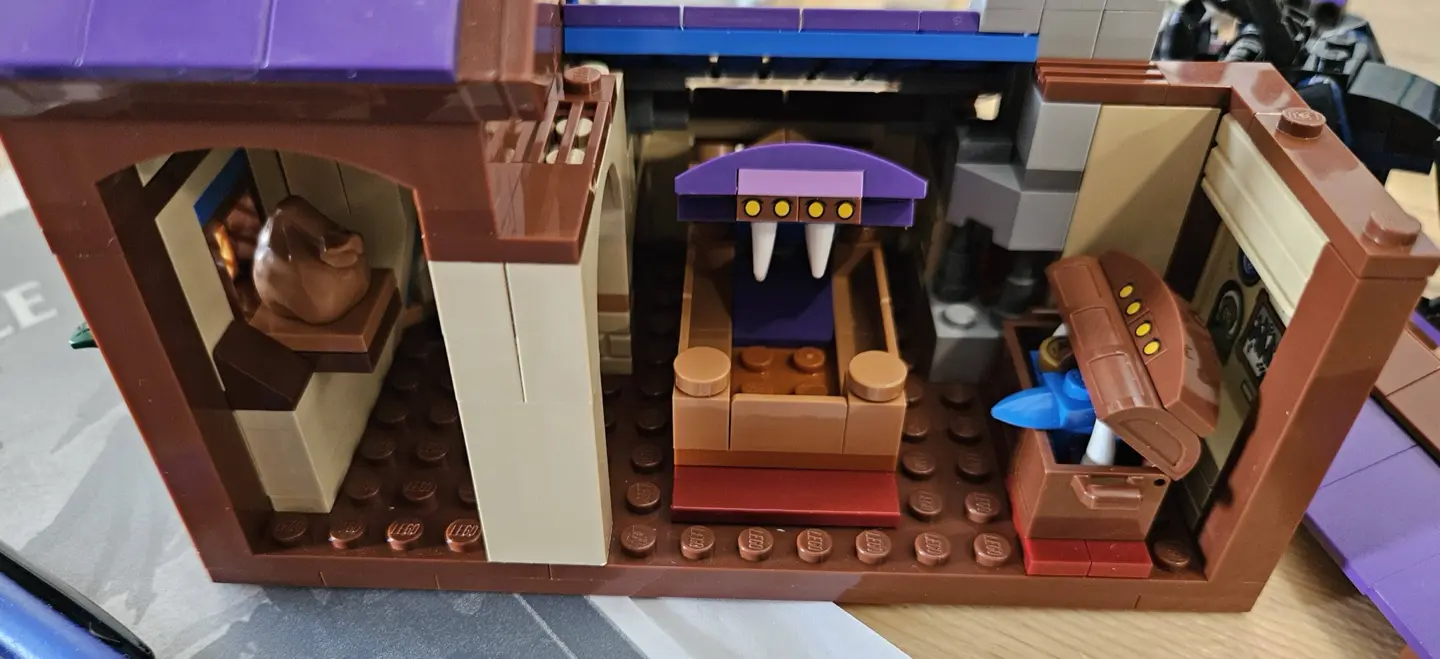 Upstairs of the tavern from LEGO set 21348 featuring a mimic bed and mimic chest both with mouths open revealing sharp teeth