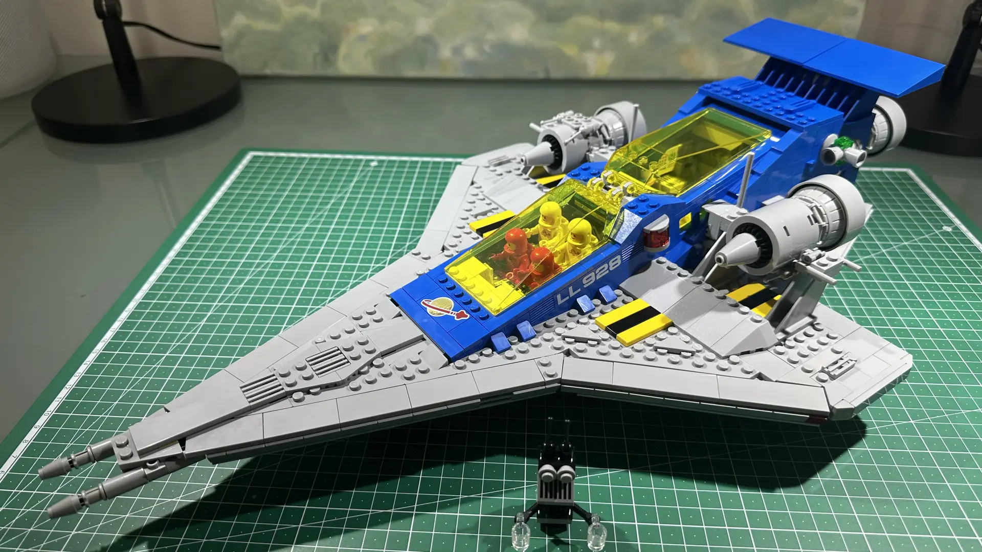 My build of LEGO set 10497 a large gray and blue spaceship with transparent yellow canopies sitting on a cutting mast